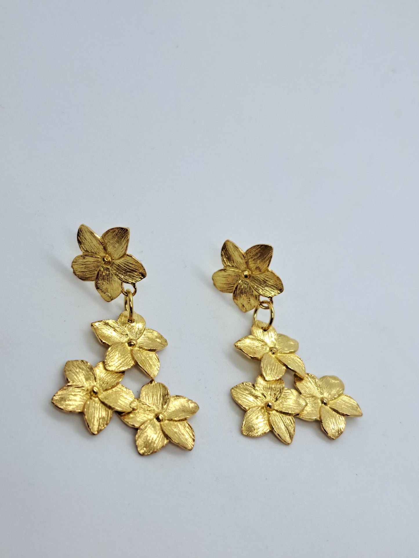 Brincos frangipani longos